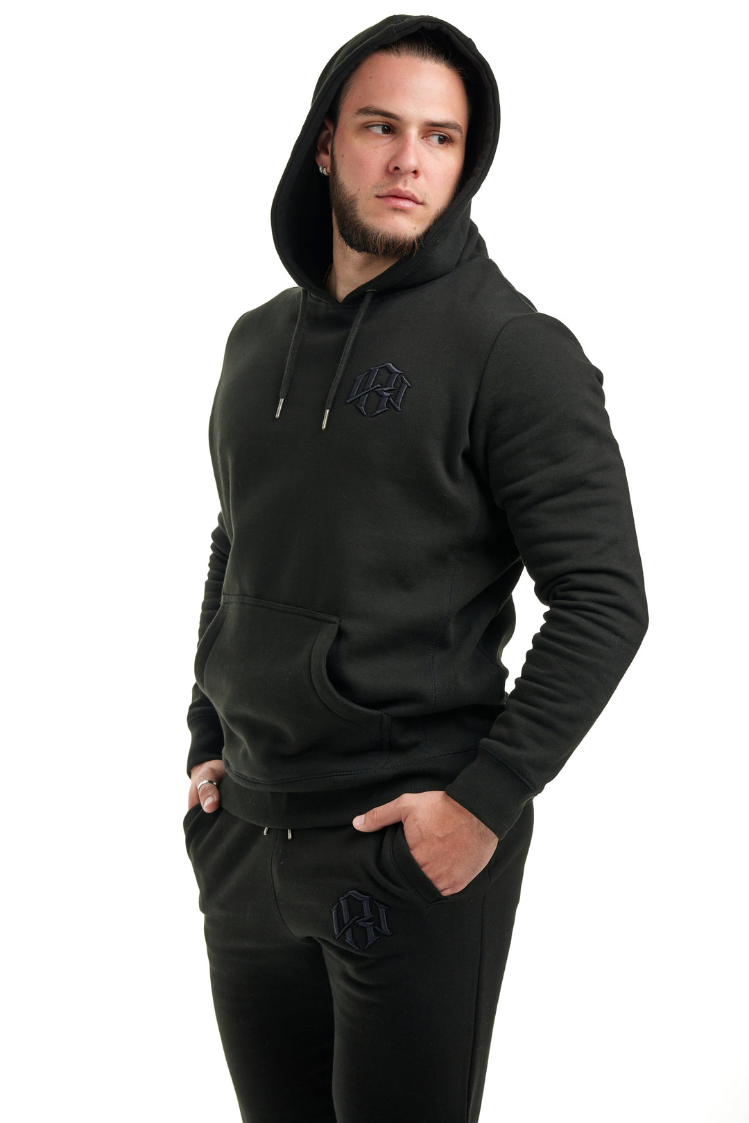 Young man in Renowned Wear 3D Motif Logo Premium Heavyweight Pre-Shrunk Hoodie in Black