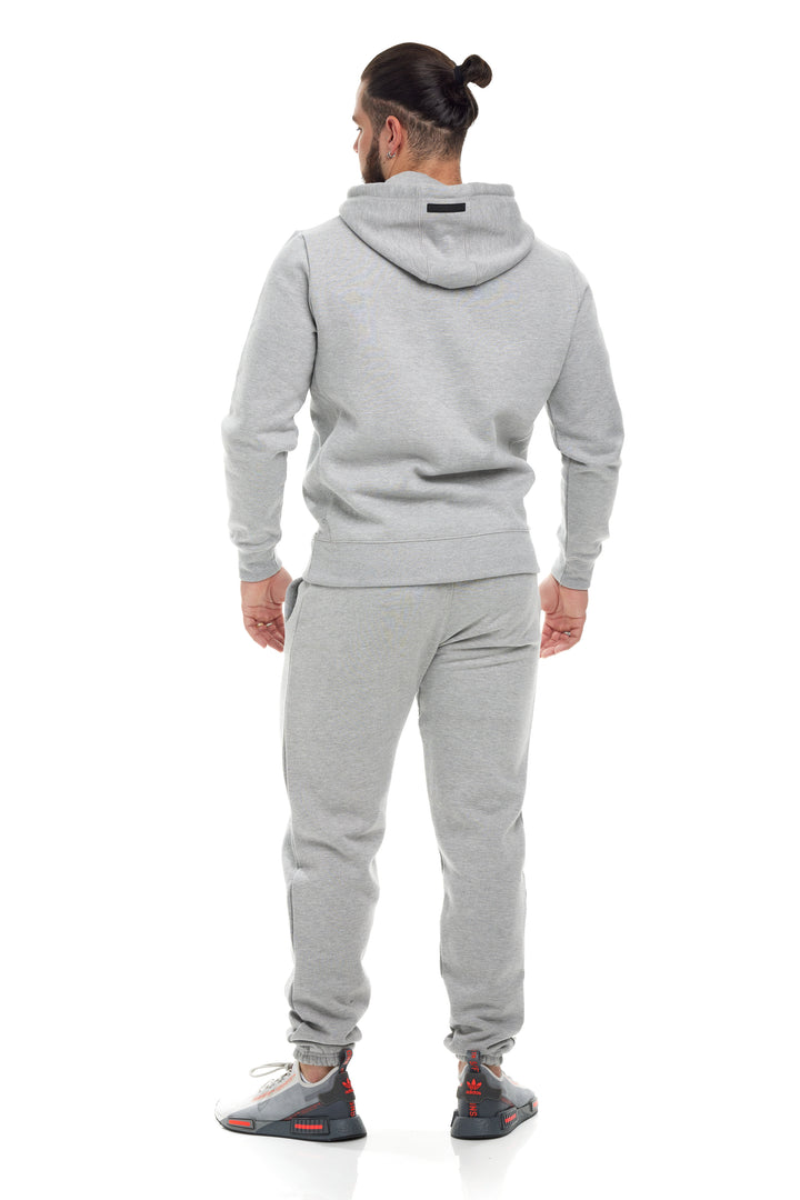 Premium Heather Grey 400gsm Heavyweight Sweatpants modeled by a young man
