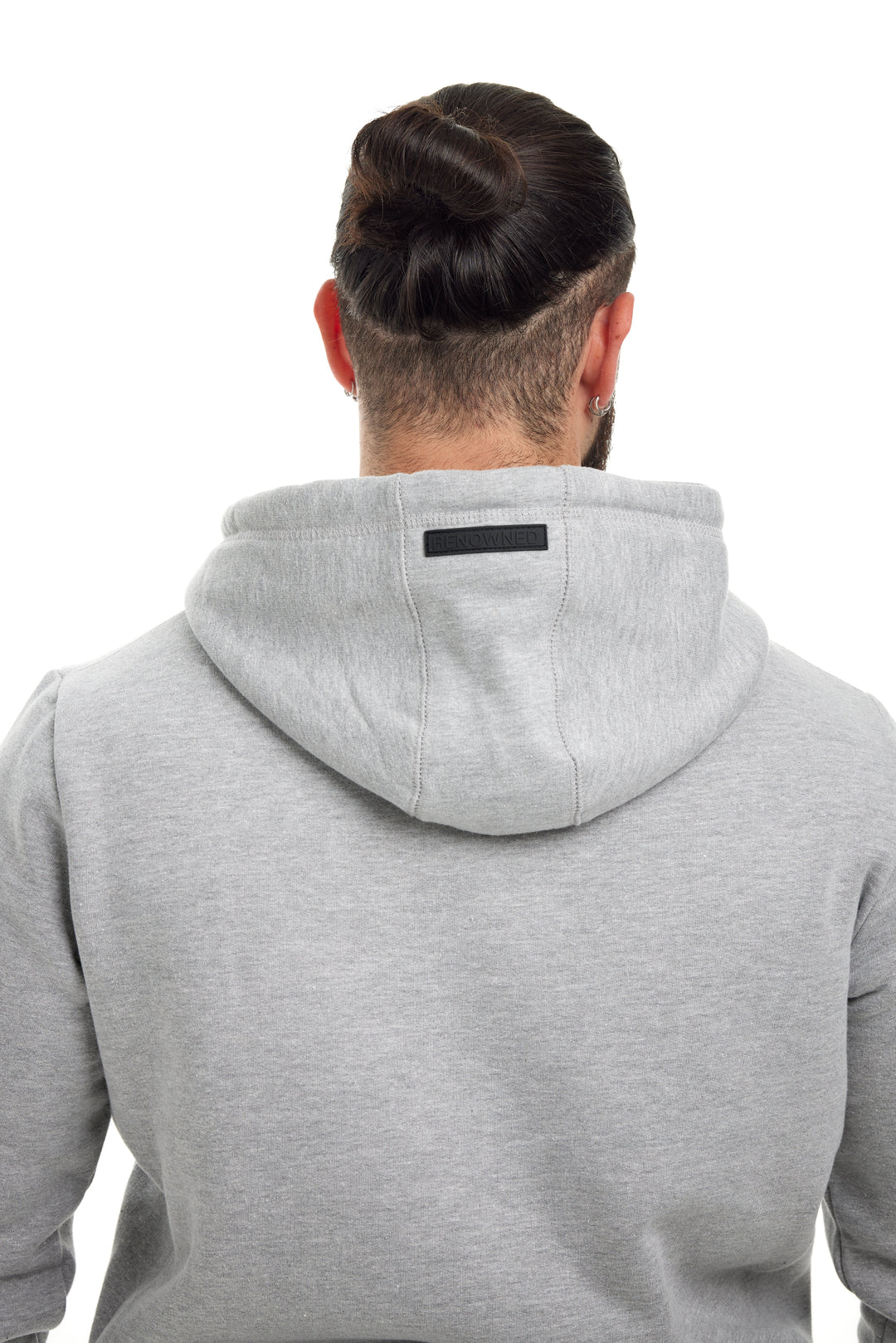 Young man modeling the Heather Grey Premium 400gsm Heavyweight Hoodie by RENOWNED WEAR
