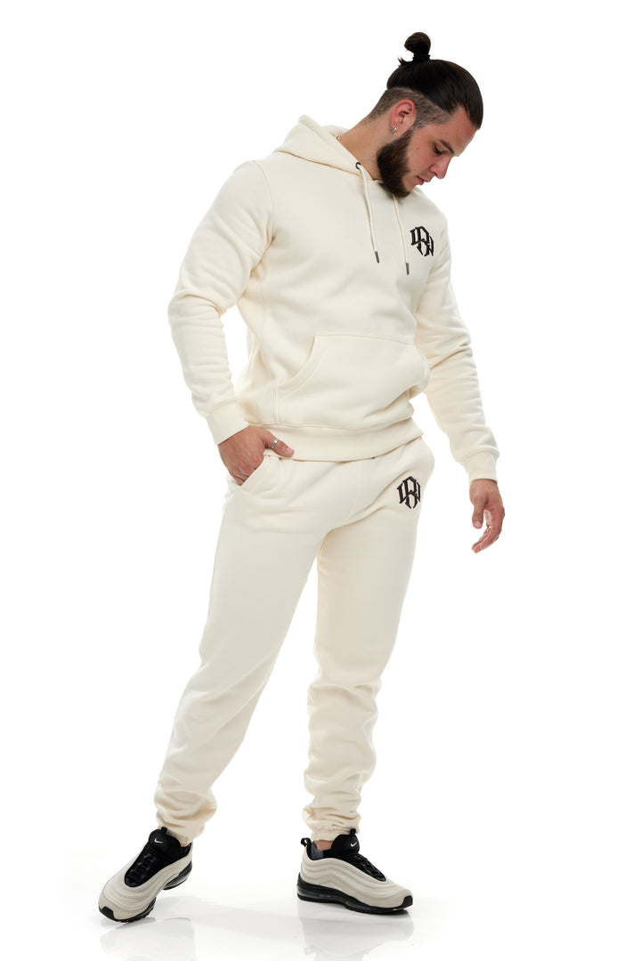 Premium 400gsm Heavyweight Cream Sweatpants modeled by a young man